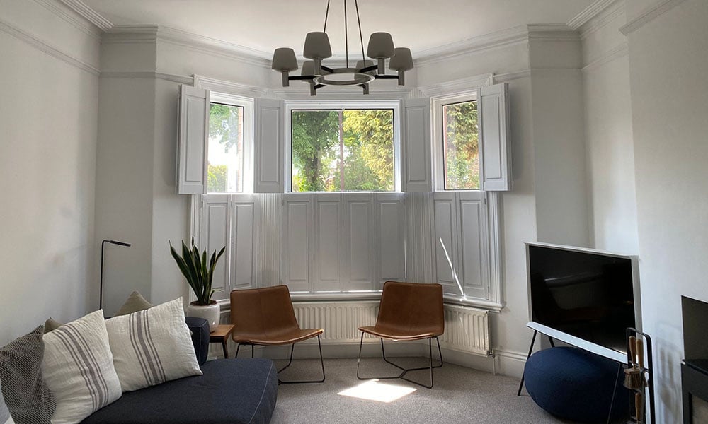 Solid panel shutters installed on a bay window