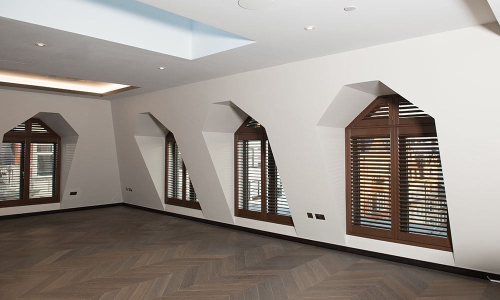 Special shaped shutters installed on uniquely shaped windows