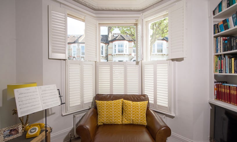 Tier-on-tier shutters installed on a bay window